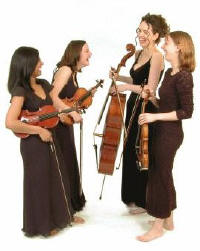 all female string quartet sharing a joke