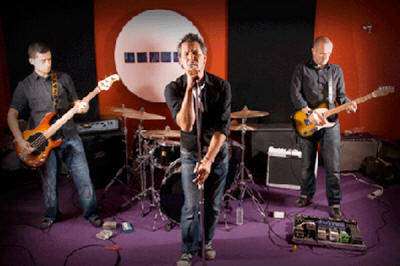 The TF Party Band Band who play in Hampshire, Surrey, Sussex and Kent, stand on purple carpet