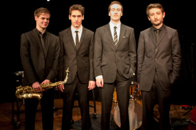 The SE Jazz Quartet Jazz Quartet stand in a line. They play in London, Middlesex, Berkshire, bedford