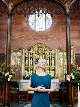 Singer - Gemma Singer in church with round window. She sings in Gloucestershire, Hampshire and Hertf