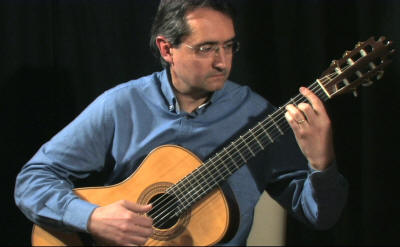 Roberto - guitarist Classical guitarist wearing blue shirt. He performs in Hertfordshirem Buckingham
